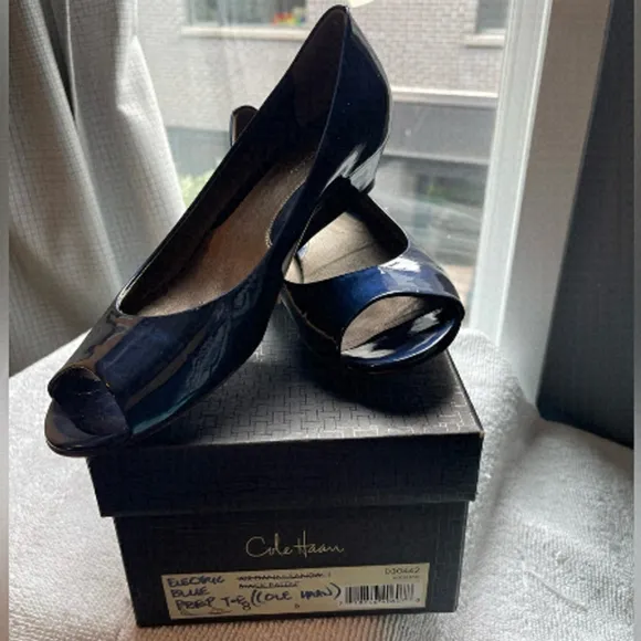 Blue patent Cole Haan open toed shoes.