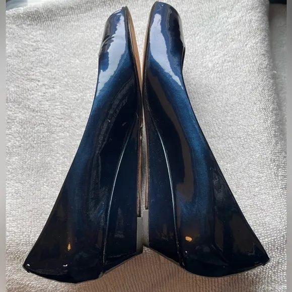 Blue patent Cole Haan open toed shoes.