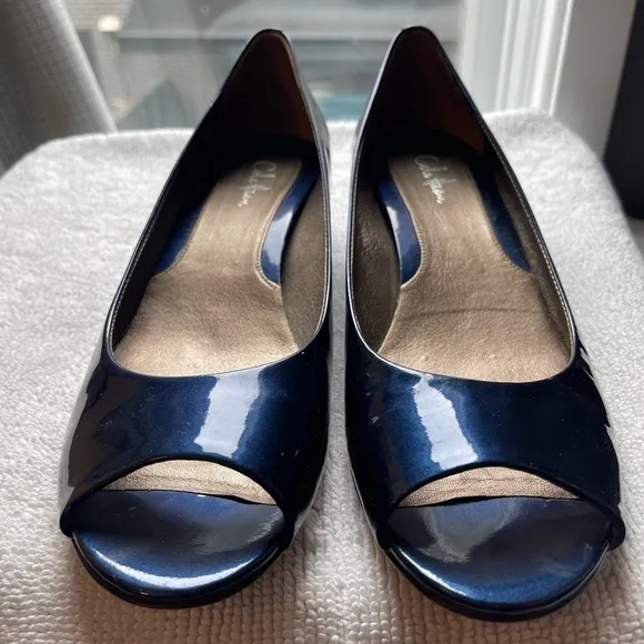 Blue patent Cole Haan open toed shoes.