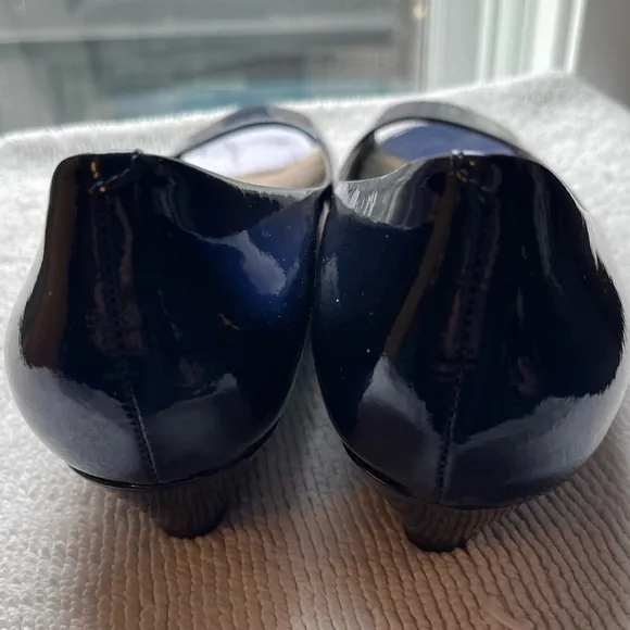 Blue patent Cole Haan open toed shoes.
