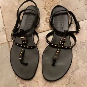 Burberry black sandals with gold accents size 7.5