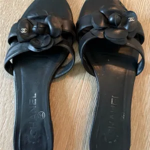 CHANEL Black Camellia Sandals Elegant Minimalist Design