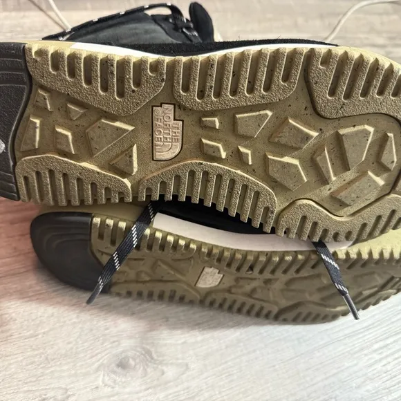 The North Face Black Boots with Padded Collar and Durable Design