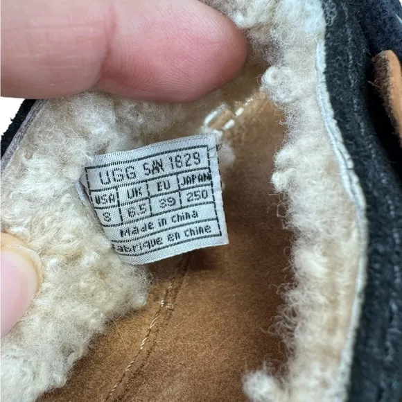 UGG Black and Tan Sandals with T-Strap Design